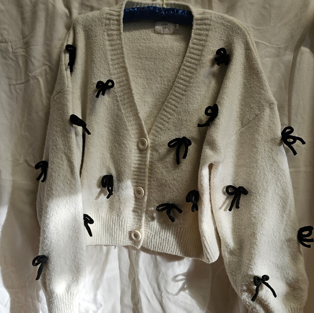 Women's Cream Cardigan Sweater with Black Bow Accents